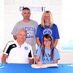 Lady Eagle senior soccer player Desirae Renfrow officially signed on to play women's soccer for Brescia University in Owensboro Thursday, Sept. 20 at Jake Russell Field. Pictured L-to-R back row: Jeff and Deanna Renfrow. Front row: Brescia head coach David Donahue and Renfrow.