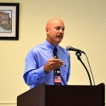 Ohio County Schools Superintendent Scott Lewis addresses the crowd at the monthly meeting and lunch of the Ohio County Chamber of Commerce last Tuesday, Sept. 18, at the Senior Center in Hartford.