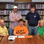 Ohio County senior graduate Austin Taylor signed on to play soccer for Georgetown College last Thursday, May 16, at OCHS. Pictured L-to-R, back row, OC coach Scott Harp and OC head coach Jeff York. Front row: Alan Taylor, Austin Taylor and Marian Smith Taylor.