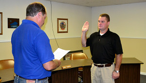 Mayor Paul Sandefur swears in Beaver Dam's newest police officer Tracy Beatty Thursday afternoon at the Beaver Dam City Building.