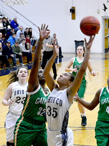 OC senior Alyssia Baker lays the ball in during the first quarter of the Lady Eagles' loss to Catholic Monday night.