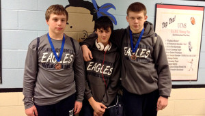 OCMS wrestlers Gage Parker, left, Adam Laws, center, and Dylan Marlow at middle school regional meet last Friday at Union Co. High School. Parker and Marlow each qualified for the Kentucky Middle School State Wrestling Championships on Feb. 8.