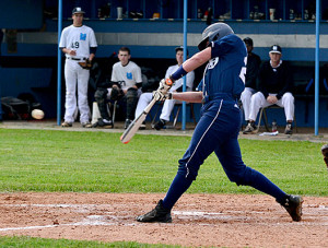 OC senior Brennon Leach smacks a line drive into the outfield for a base hit during the Eagles' loss at Muhlenberg County Friday night.