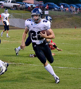 Eagle receiver Colbren Inglis catches a pass and runs the ball downfield during OC's loss to Hancock County Friday.
