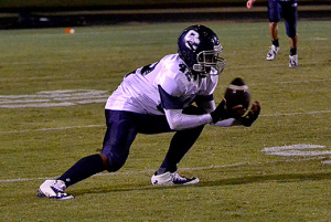 OC's Alex Hunt picks up the ball from a kickoff for a return during Eagles loss to Christian County Friday night in Hopkinsville.