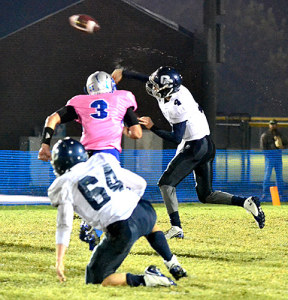 OC senior quarterback Nate Morris slings a wet football during the Eagles' loss to Graves County Friday night.