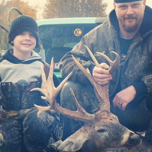 Elijah McIntyre, left, with his father, Michael McIntyre, with Elijah's first ever deer. A 19-point non-typical buck. (Photo submitted)