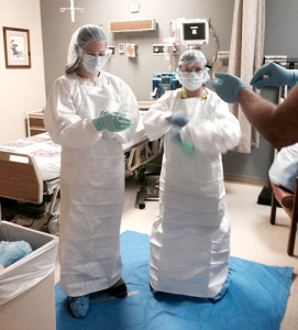 Ohio County Hospital nursing staff practicing putting on the PPE (personal protective equipment) suits.