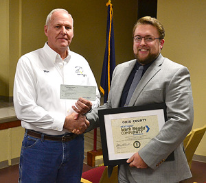 Wayne Neal with the Ohio County Industrial Foundation presents Chase Vincent, executive director of the Ohio County Economic Development Alliance, with a check for $1,000 to go toward the ACT WorkKeys testing offered by the Ohio County Career Center.
