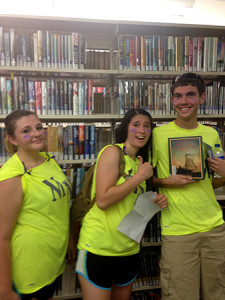 Megan Middleton, Brittany Bongiovanni and Garrett Westerfield face a book challenge at the Warren County Public Library.