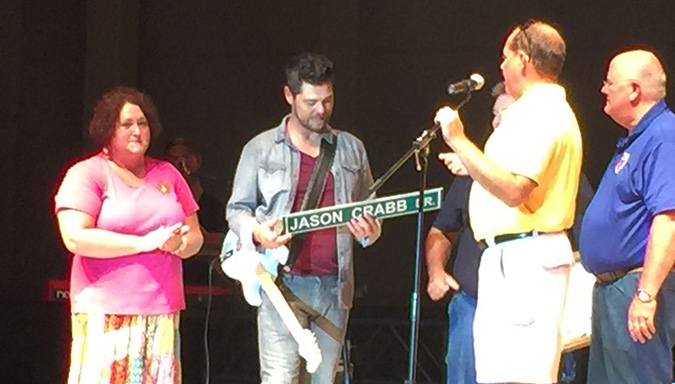 The Beaver Amphitheater entrance was named after Beaver Dam native and Grammy award winning gospel singer Jason Crabb Saturday night as Crabb was presented with a replica sign at his concert Saturday night. (Photo submitted)