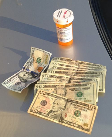 Drugs and cash seized during an undercover drug sting by the Ohio County Sheriff's Department recently.