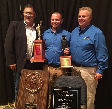 Taber Tichenor, Kentucky Coal Academy Mine Rescue team member, accepts the 2015 National Mining Association Mine Rescue Bench Biopak Award from Ted Beck, Biomarine Inc. sales manager, and Danny Knott, KCA Mine Rescue director.