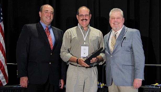 Beaver Dam Mayor Paul Sandefur accepts the Enterprise Cities Award from KLC Executive Director/CEO Jon Steiner (left) and KLC President and Williamsburg Mayor Roddy Harrison (right).